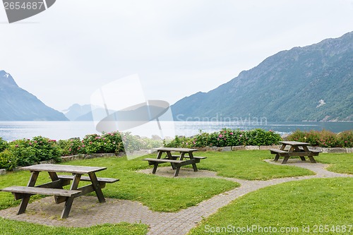 Image of Table and benches for picnic on fjord shore