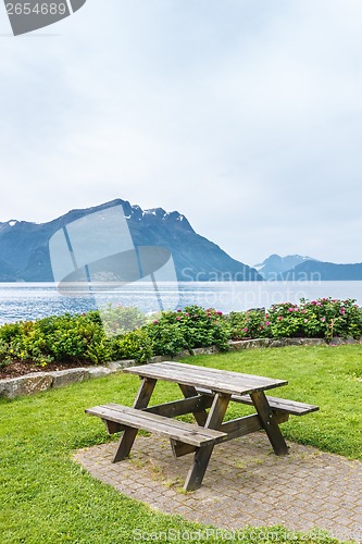 Image of Table and benches for picnic on fjord shore