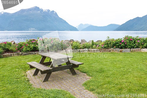 Image of Table and benches for picnic on fjord shore