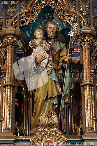Image of Saint Joseph holding baby Jesus