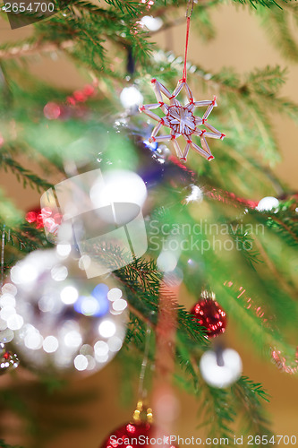 Image of Christmas decoration on tree with light