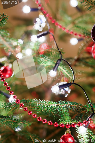 Image of Christmas decoration on tree with light