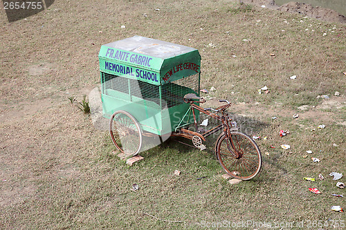 Image of Bicycle ricksha which transported children to school, Kumrokhali, West Bengal, India