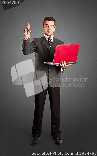 Image of Business Man Shows Something With Finger