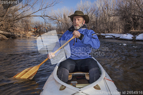 Image of senior canoe paddler