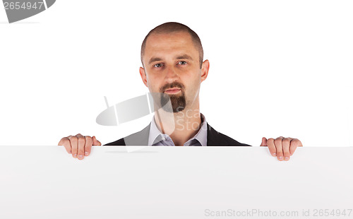 Image of Mature businessman holding billboard
