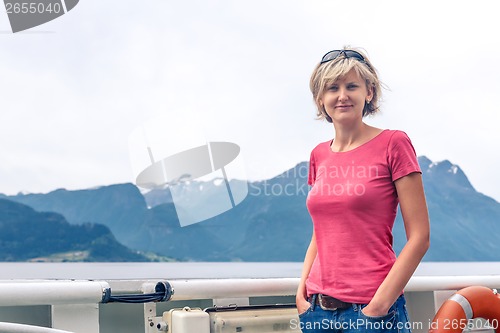 Image of Woman tourist sailing on a sightseeing ferry boat