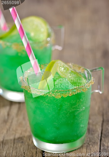 Image of Cocktail with lime and ice in a glass