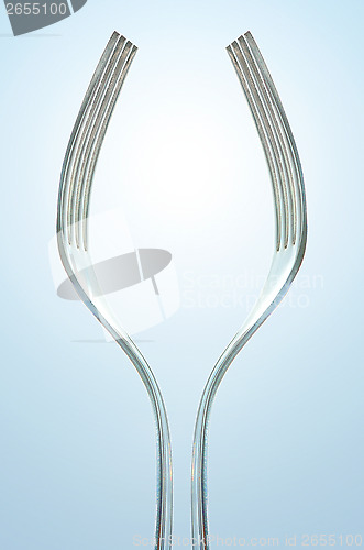 Image of abstract fork making tall wine glass