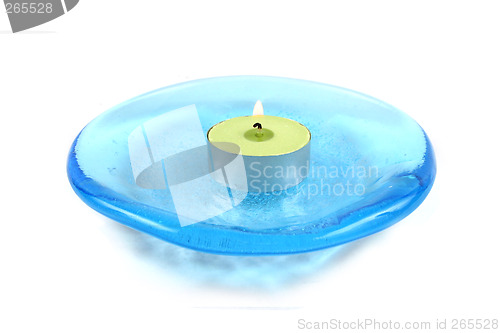 Image of Candle on a blue glass dish