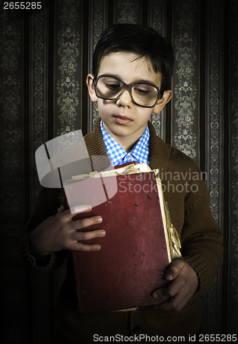Image of Child with red vintage book
