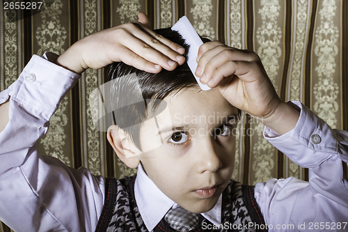 Image of Child vintage clothes decided his hair