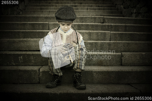 Image of Child with vintage camera