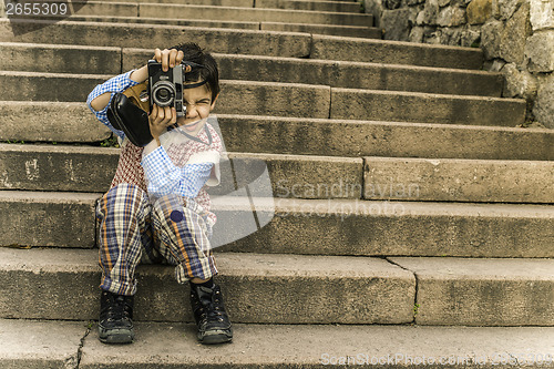 Image of Child with vintage camera