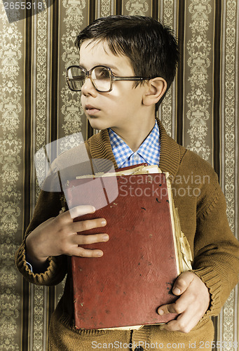 Image of Child with red vintage book