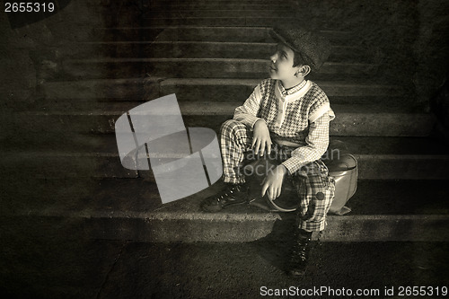 Image of Exterior stairs and child with vintage bag