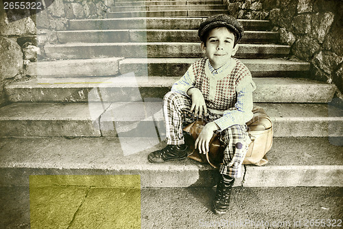 Image of Exterior stairs and child with vintage bag