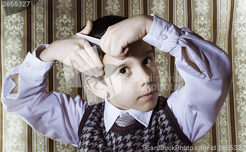 Image of Child vintage clothes decided his hair