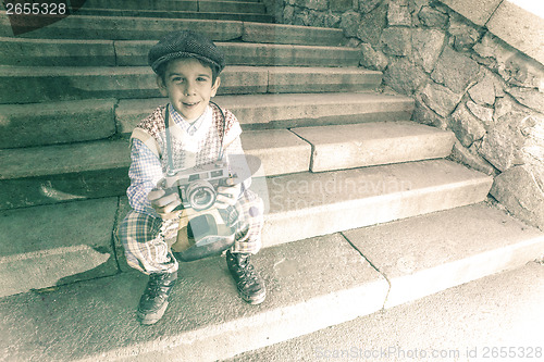 Image of Child with vintage camera