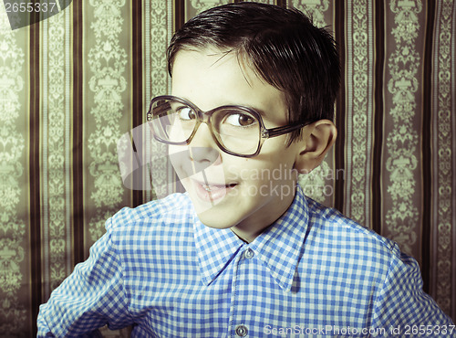 Image of Smiling child with glasses in vintage clothes