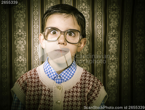 Image of Smiling child with glasses in vintage clothes
