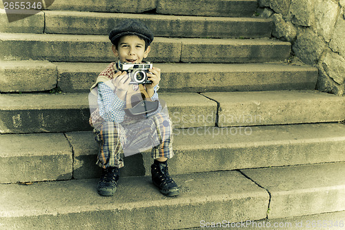 Image of Child with vintage camera