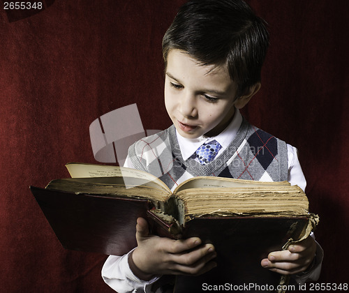 Image of Child with red vintage book