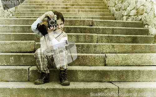 Image of Child with vintage camera