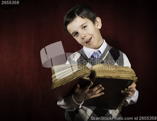 Image of Child with red vintage book