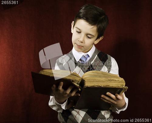 Image of Child with red vintage book