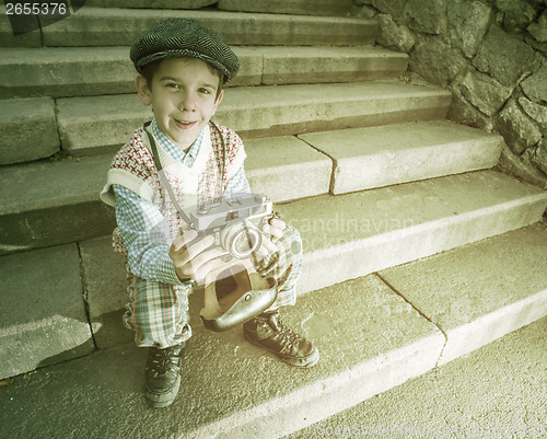 Image of Child with vintage camera