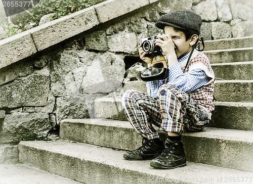 Image of Child with vintage camera