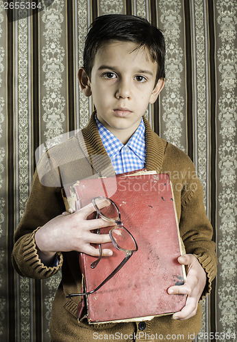 Image of Child with red vintage book