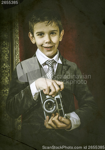 Image of Child taking pictures with vintage camera