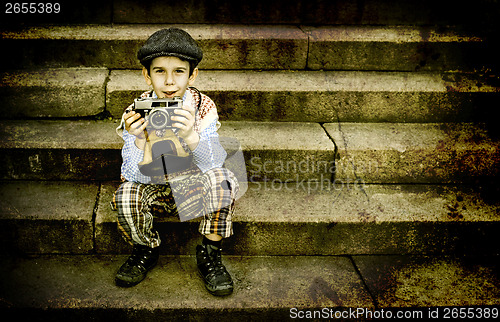 Image of Child with vintage camera