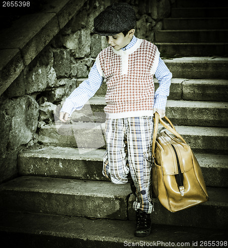 Image of Exterior stairs and child with vintage bag