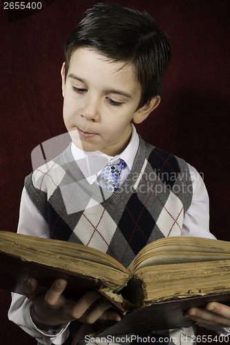 Image of Child with red vintage book