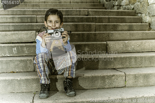 Image of Child with vintage camera
