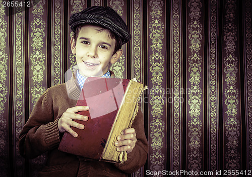 Image of Child with red vintage book