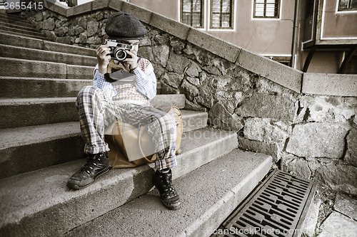 Image of Child with vintage camera