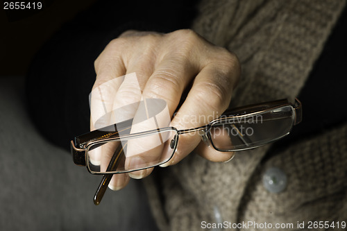Image of Women hand hold glasses