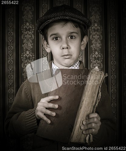 Image of Child with red vintage book