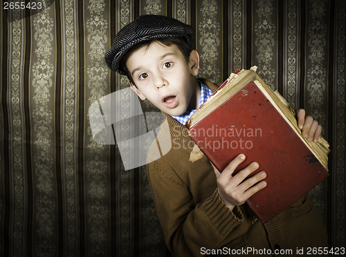 Image of Child with red vintage book