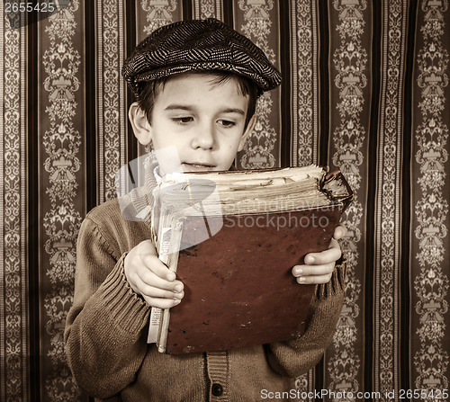 Image of Child with red vintage book