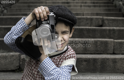 Image of Child with vintage camera