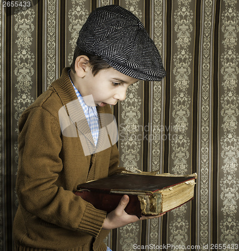 Image of Child with red vintage book