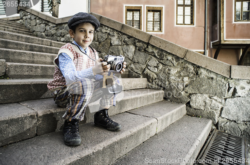 Image of Child with vintage camera