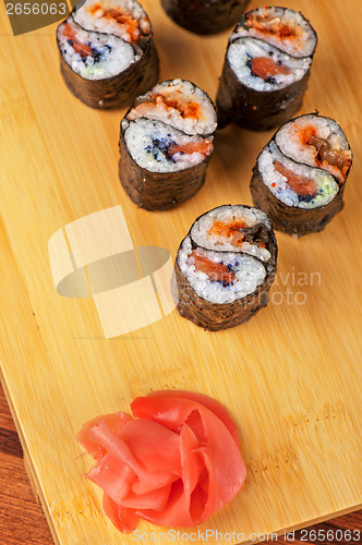 Image of sushi rolls with tobico and pancake