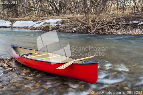 Image of red canoe on a river
