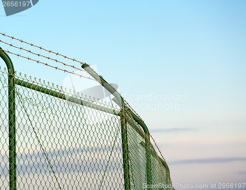 Image of Mesh fence with barbed wire